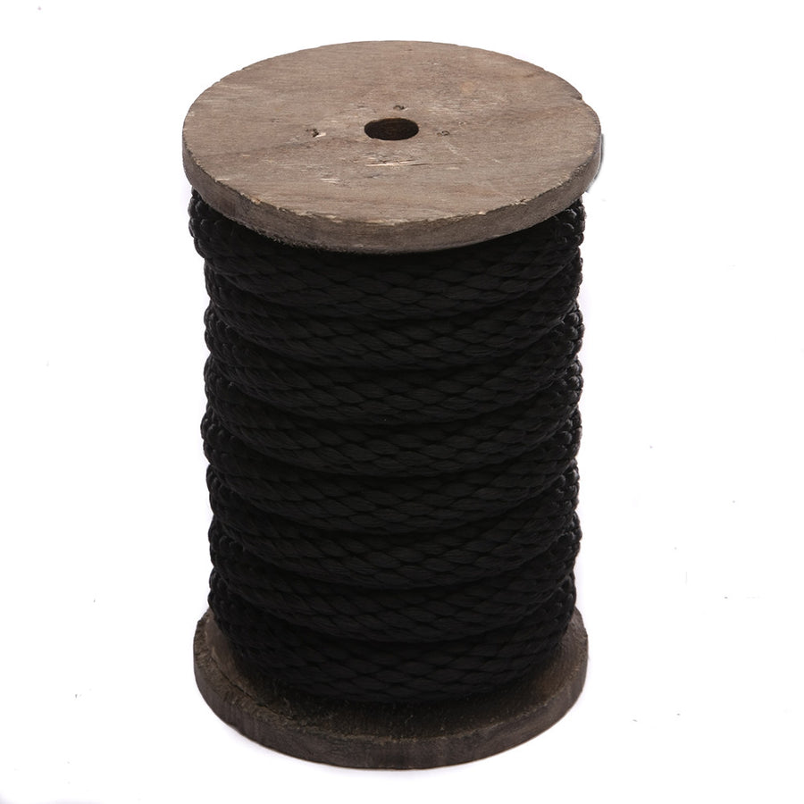 Knotty Desires black polypropylene bondage rope on a spool standing vertically.