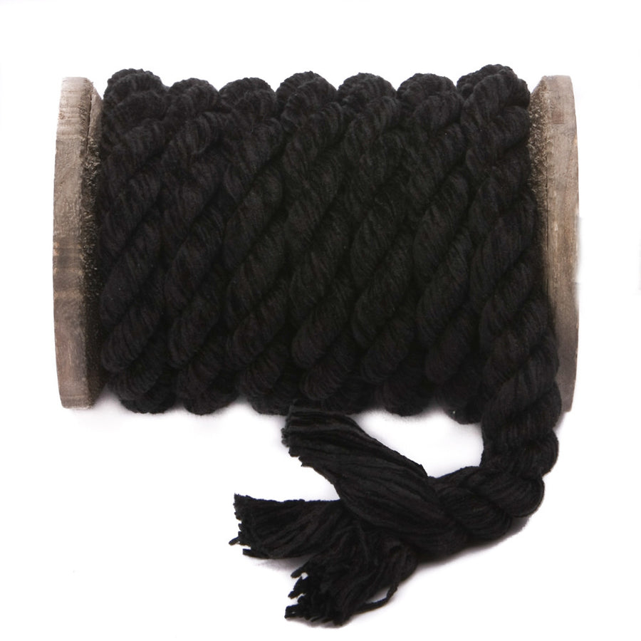 Knotty Desires Black Twisted Chenille Bondage Rope on a spool unraveled to show the individual strands.