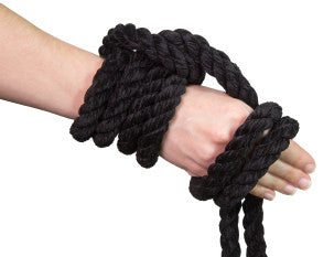 Knotty Desires Twisted Chenille Rope in black knotted on a hand.
