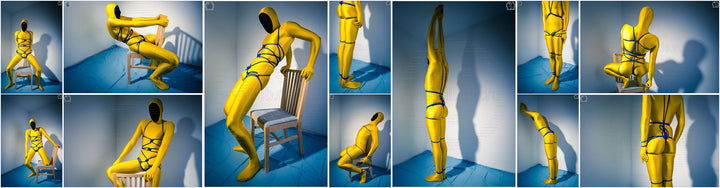 Person in bright yellow body suit in bondage with blue bondage rope.