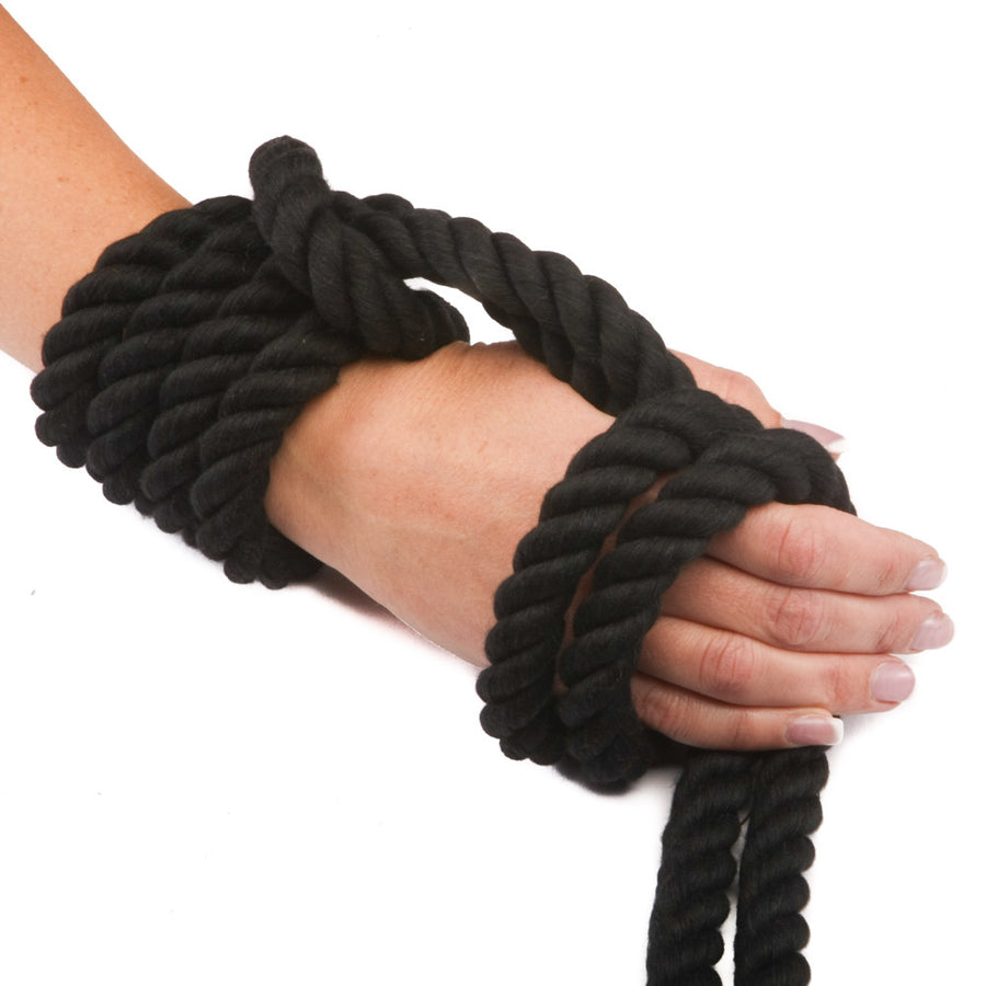 Knotty Desires Twisted Cotton Bondage Rope in black knotted on a hand.