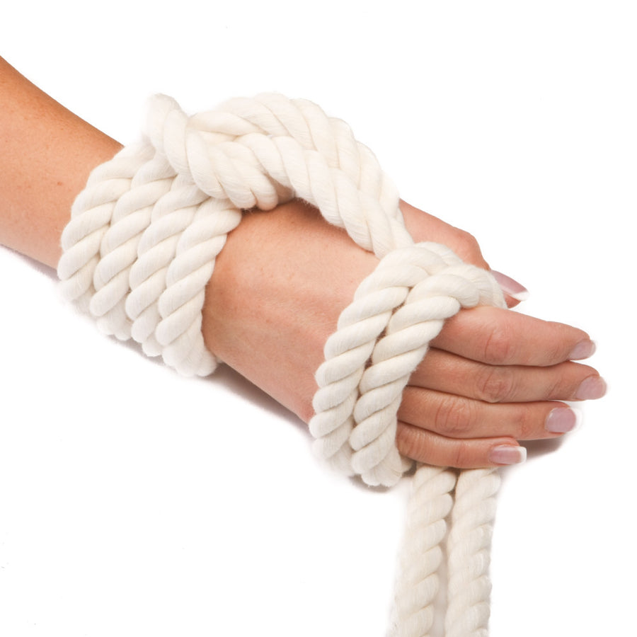 Knotty Desires Twisted Cotton Bondage Rope in natural white tied on a hand.