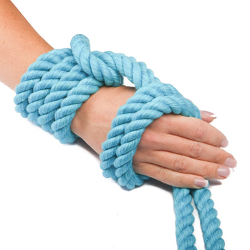 Knotty Desires Turquoise Twisted Cotton Bondage Rope tied on a hand.