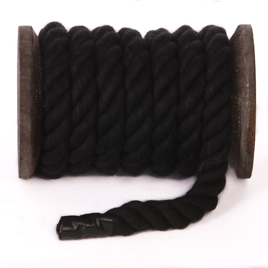 Knotty Desires Twisted Cotton Bondage Rope in black on a spool.