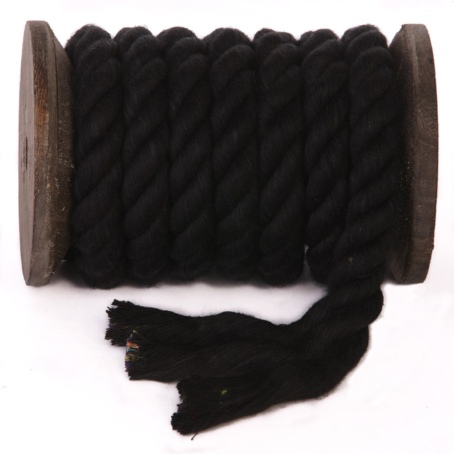 Knotty Desires Twisted Cotton Bondage Rope in black on a spool showing the individual strands that makes up the twisted cotton bondage cordage.
