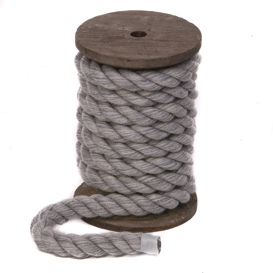 Grey Twisted Cotton Bondage Rope by Knotty Desires on a spool standing vertically.