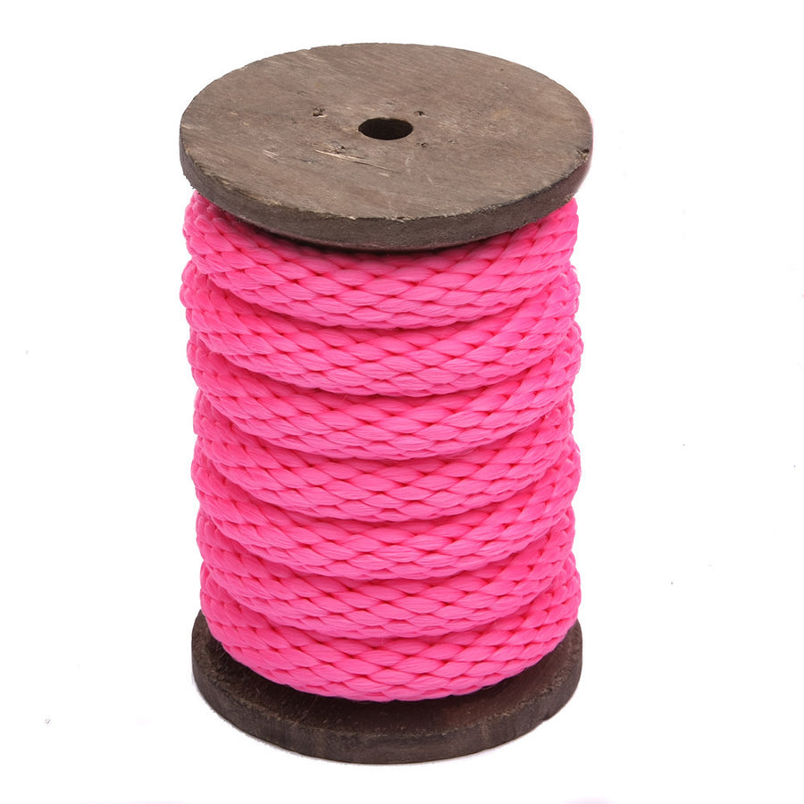 Knotty Desires hot pink bondage rope on a vertical spool.