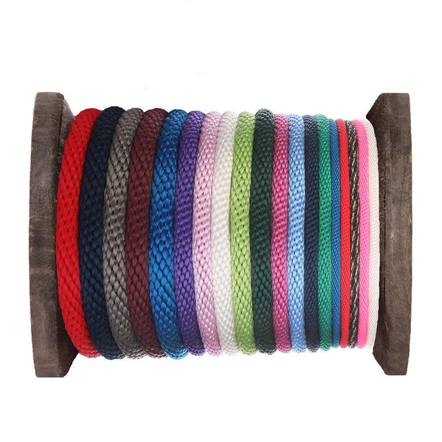 Knotty Desires polypropylene bondage rope in multiple colors and diameters on a spool.