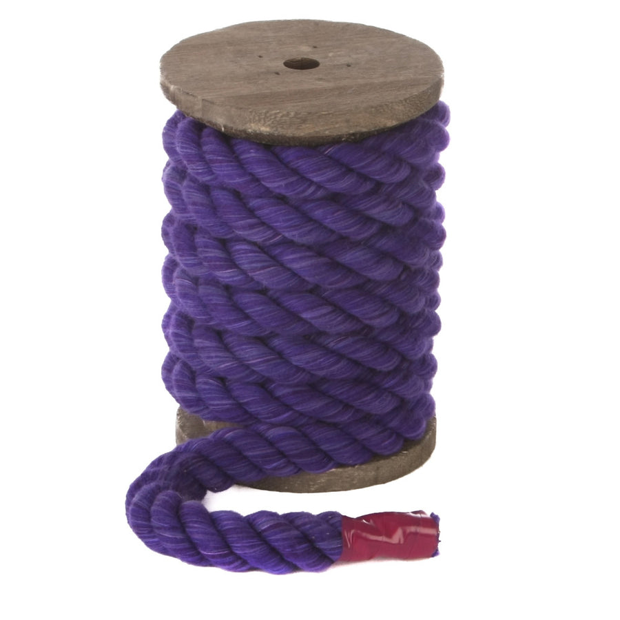 Knotty Desires Twisted Cotton Bondage Rope in purple on a spool standing vertically.