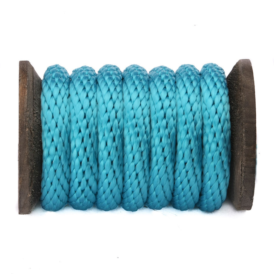Knotty Desires Polypropylene Bondage Rope in the color Turquoise on a spool.