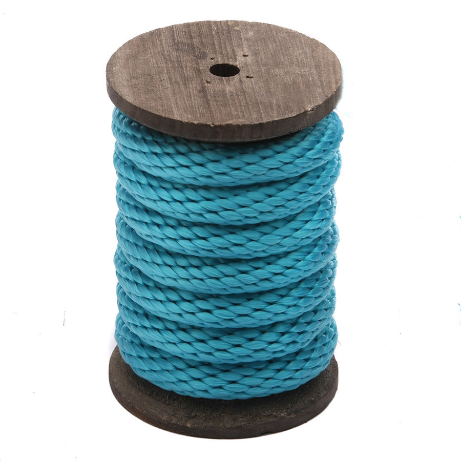 Knotty Desires Turquoise Polypropylene Bondage Rope on a spool standing vertically.